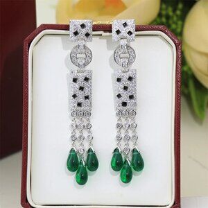 Square spotted green tassel earrings